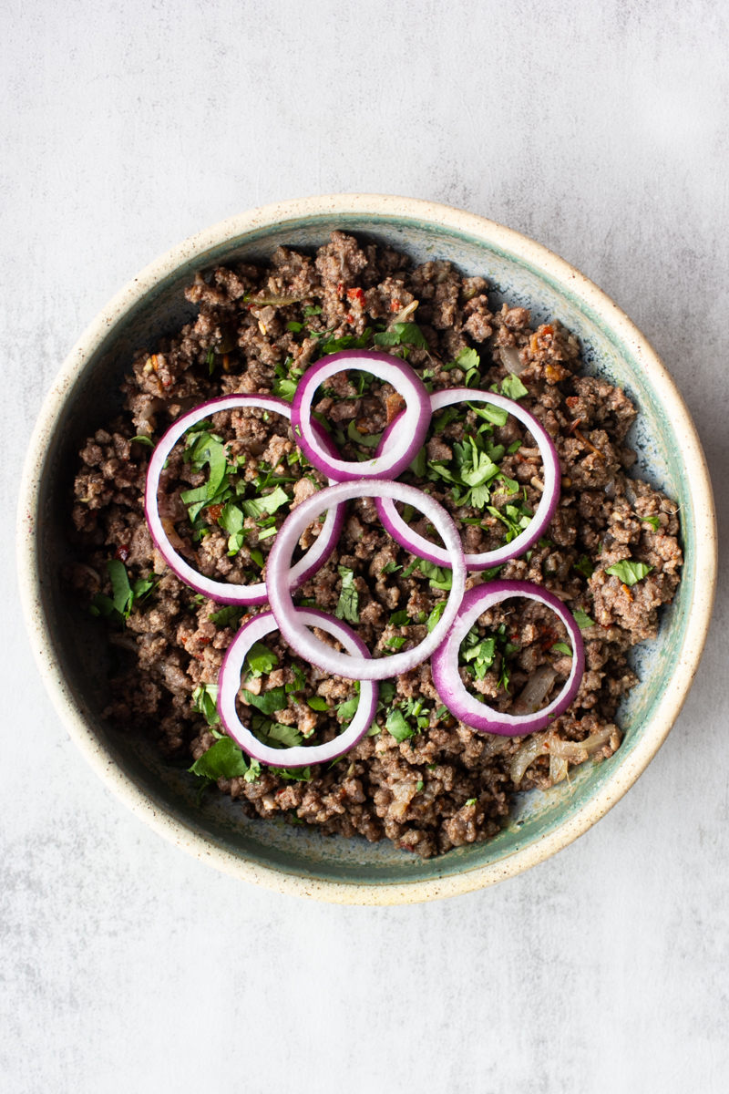 Khara masala keema with cilantro and sliced onion